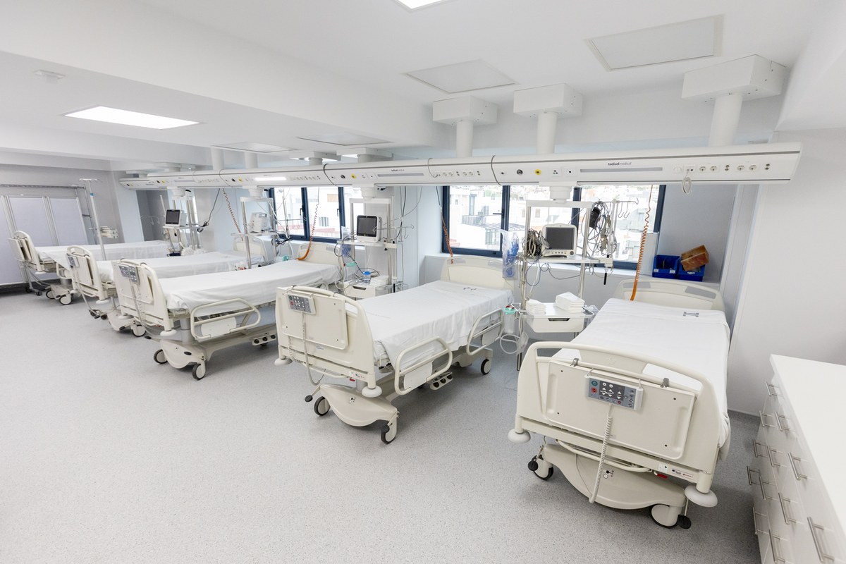 Treatment room of a modern private clinic with beds and medical equipment