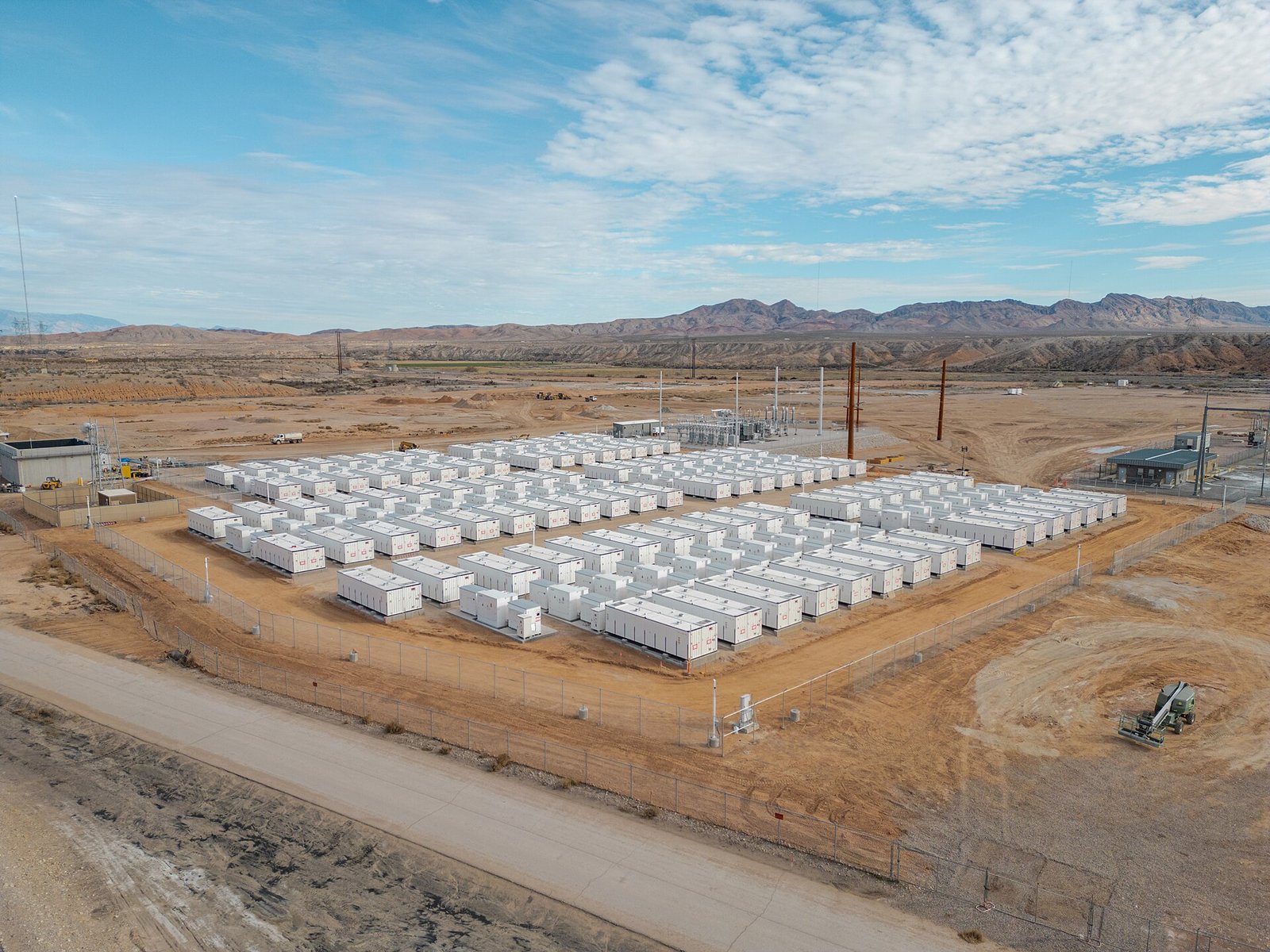 Aerial view of a large solar farm with battery storage units on rehabilitated land in Arico, Tenerife