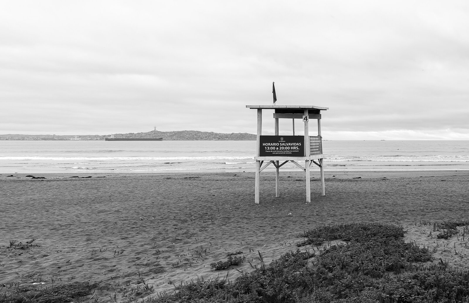 Lifeguard tower on an empty beach (illustrative)