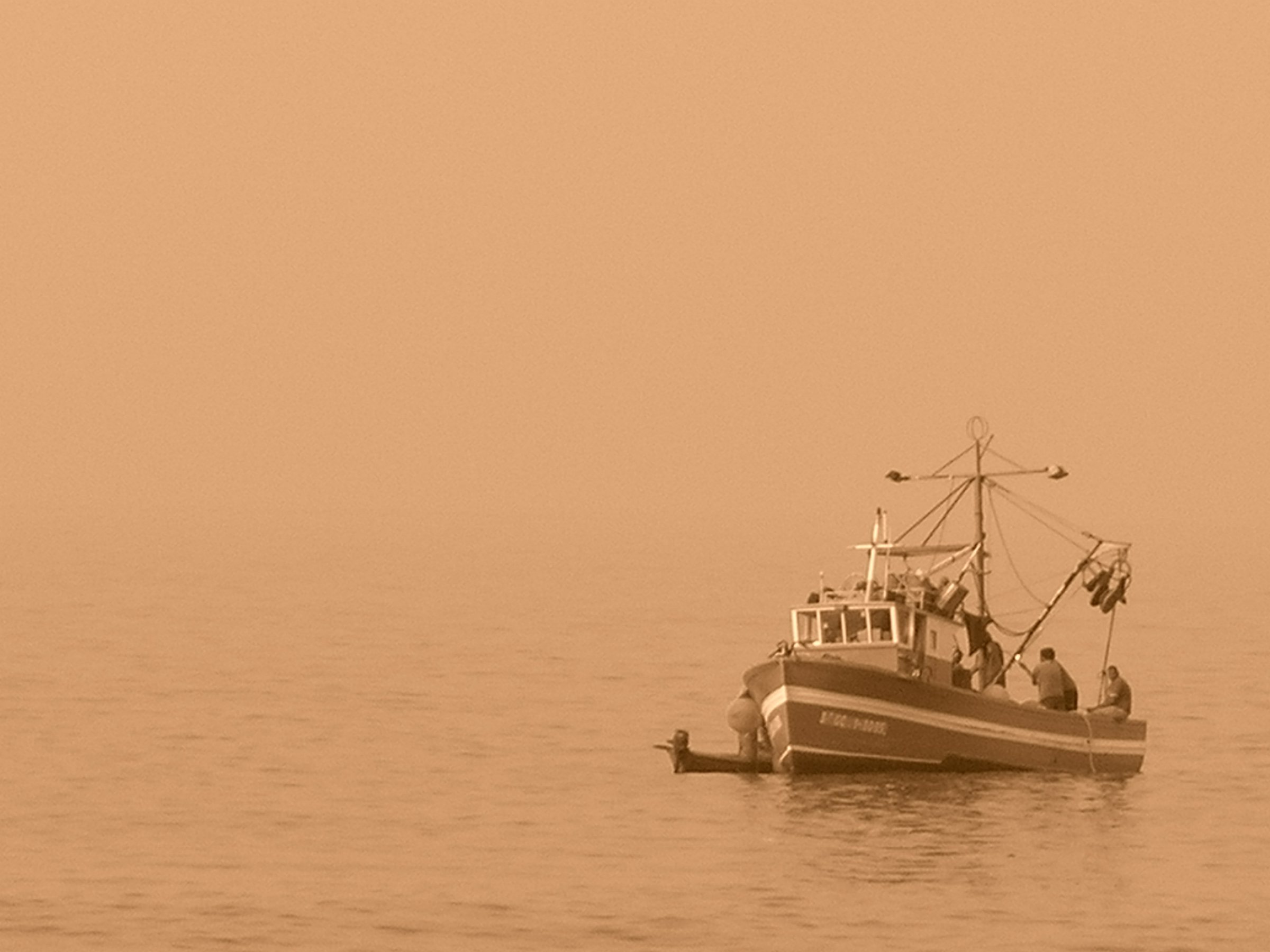 File photo: Fishing boat in the haze of the calima