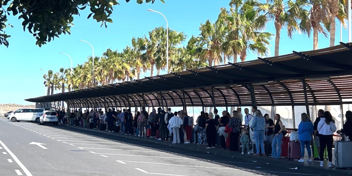 Travellers waiting at a transport hub on the Canary Islands