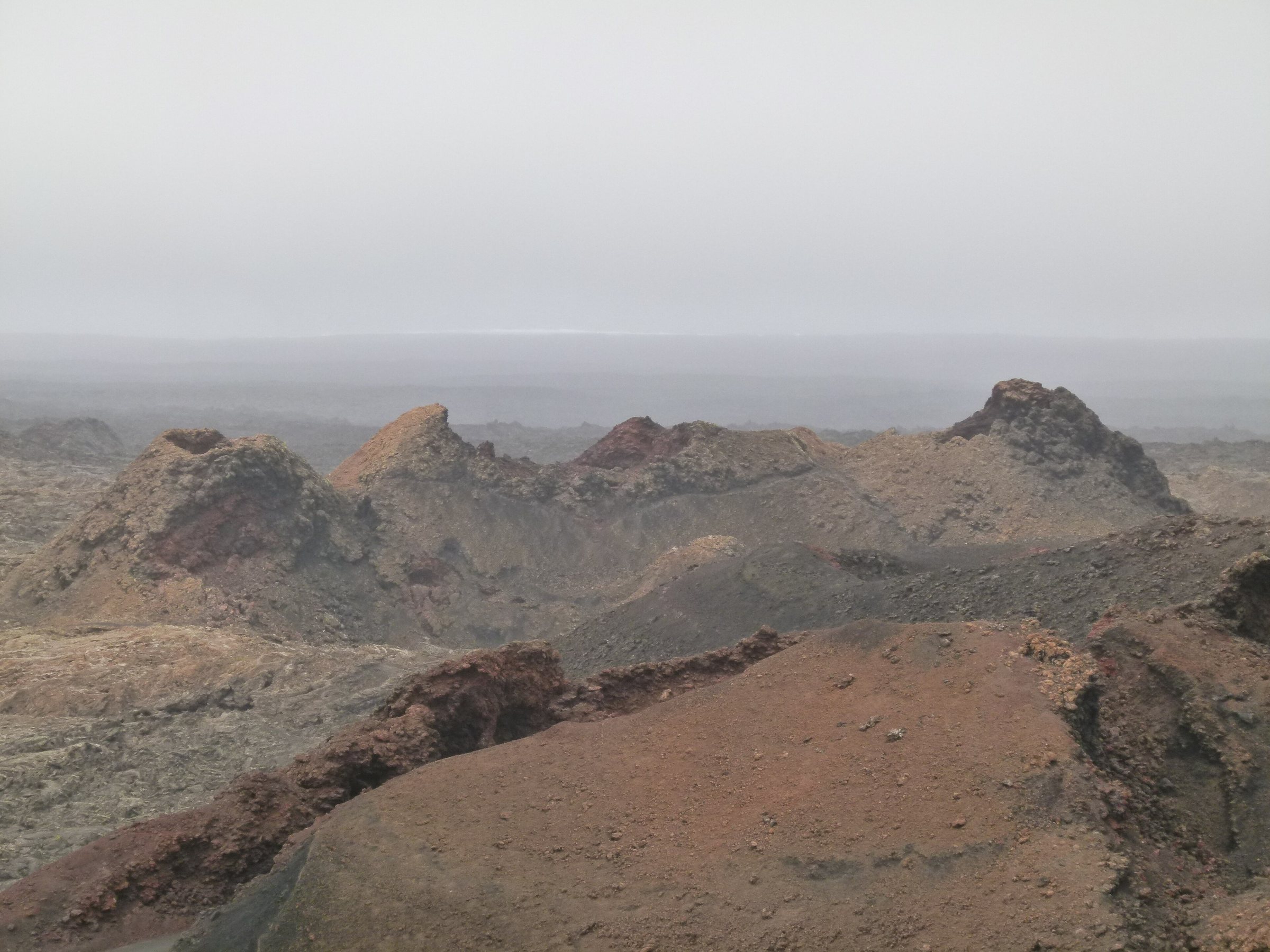 Immagine d'archivio: Montanas del Fuego - Timanfaya national park on a foggy rainy day - Lanzarote
