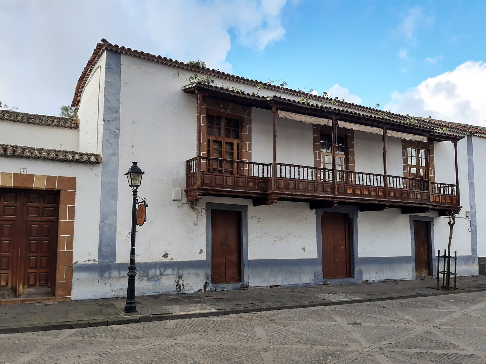 Historic street with traditional Canarian wooden balconies in Teror, Gran Canaria