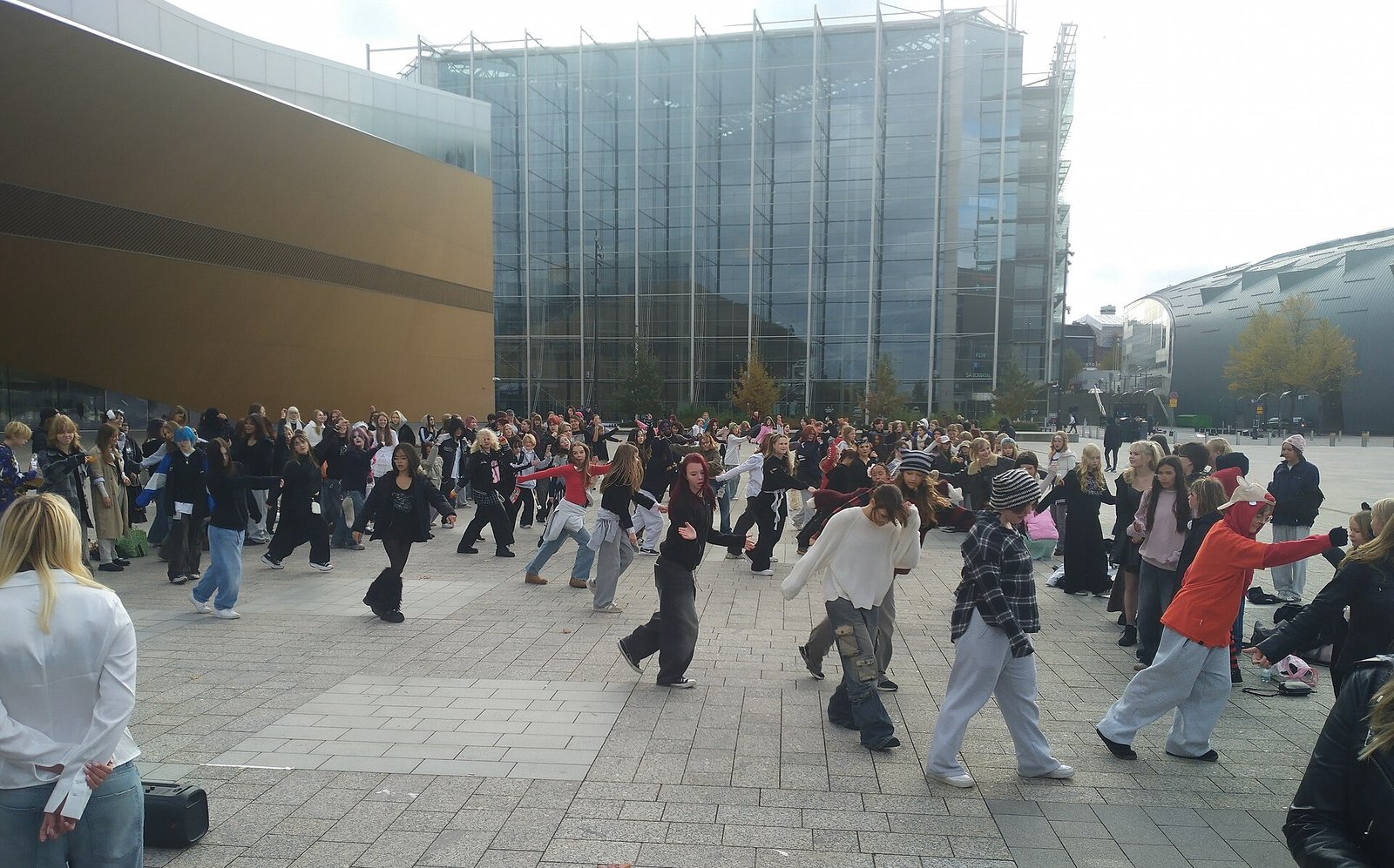 Crowd enjoying a K-Pop stage performance at a summer convention